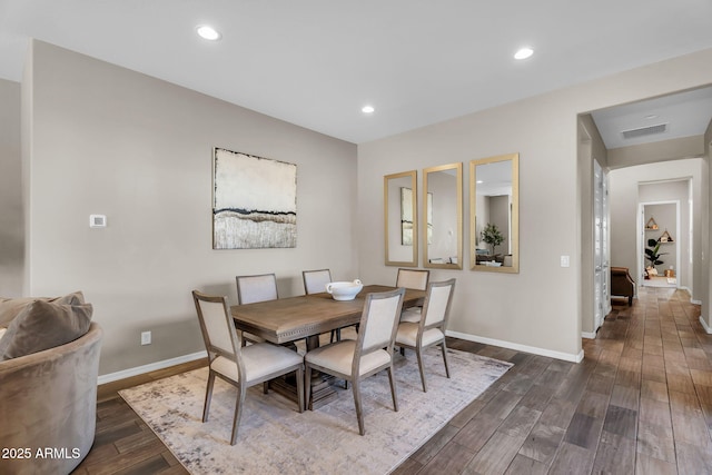 dining space with dark wood-style flooring, baseboards, visible vents, and recessed lighting