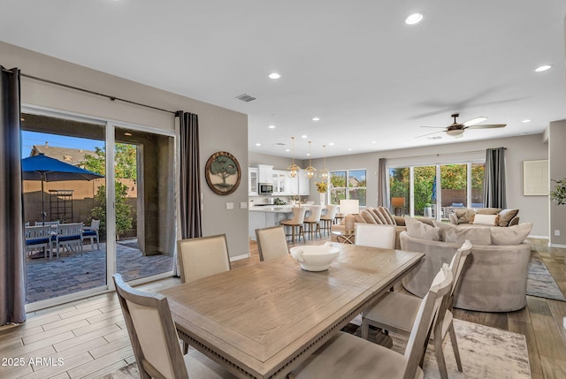 dining room with visible vents, recessed lighting, light wood finished floors, and baseboards