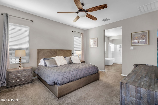 carpeted bedroom with baseboards, a ceiling fan, connected bathroom, and visible vents