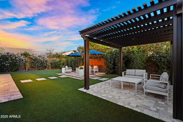 yard at dusk featuring a patio, an outdoor living space, a fenced backyard, and a pergola