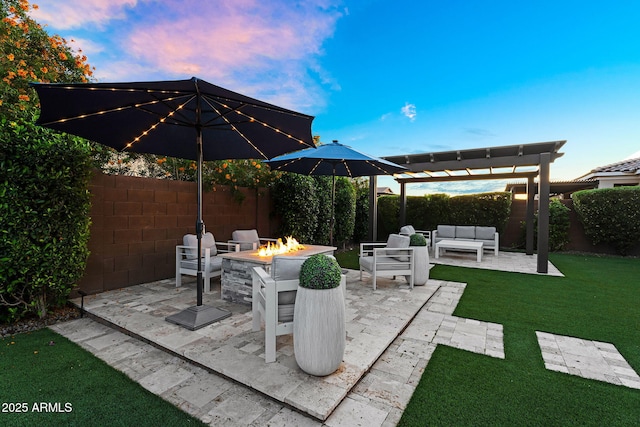 view of patio / terrace featuring a pergola, a fenced backyard, and an outdoor living space with a fire pit