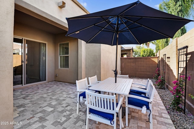view of patio / terrace with a fenced backyard and outdoor dining area
