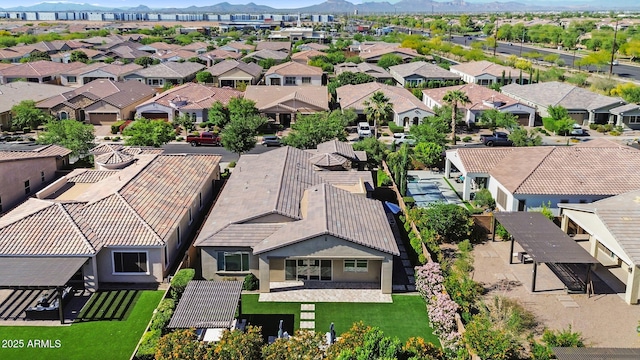 birds eye view of property with a residential view and a mountain view