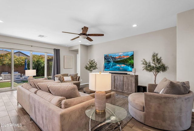 living room featuring ceiling fan, recessed lighting, wood finished floors, and visible vents