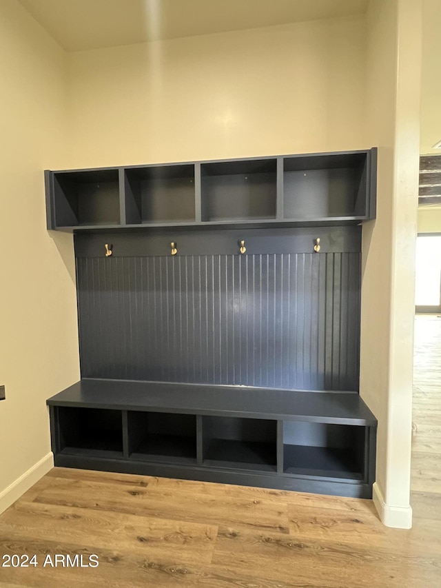 mudroom with wood-type flooring