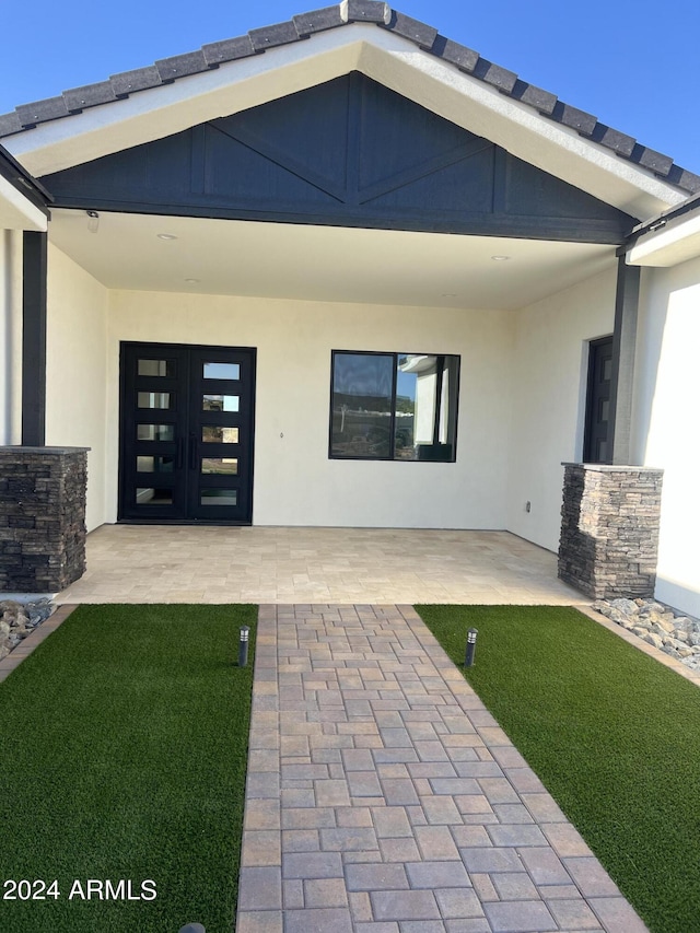 entrance to property featuring french doors