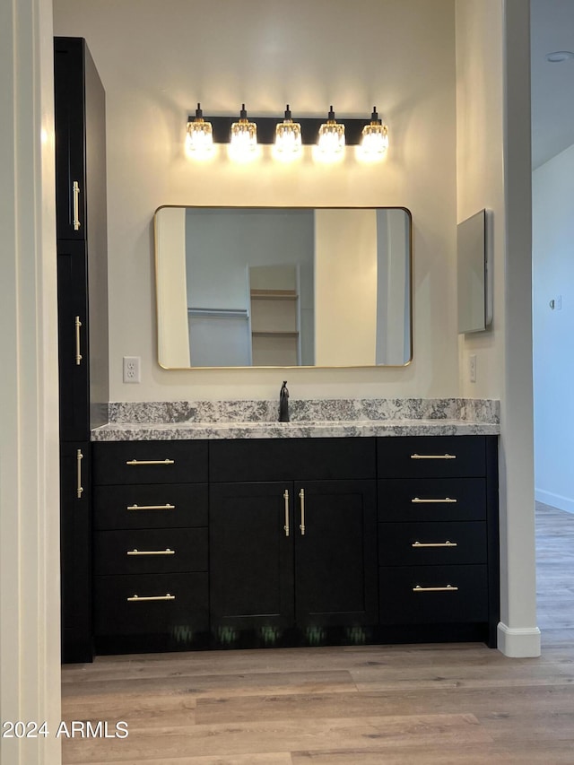 bathroom featuring hardwood / wood-style floors and vanity