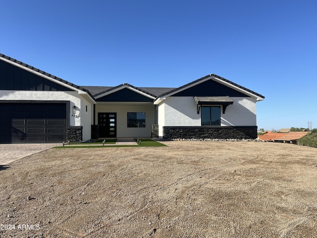 single story home with a garage