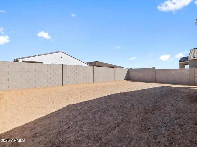 view of yard with a fenced backyard