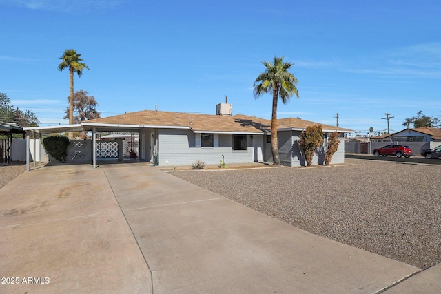 ranch-style house with a carport