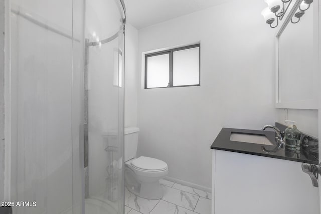 bathroom featuring vanity, toilet, and an enclosed shower