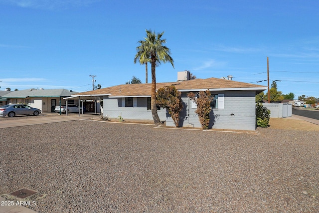 ranch-style house with a carport