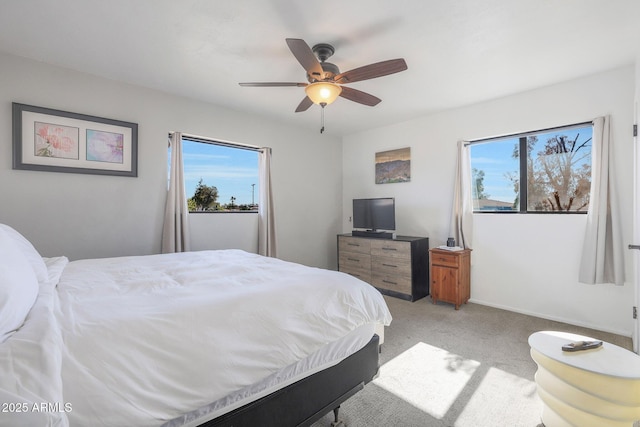 carpeted bedroom with ceiling fan