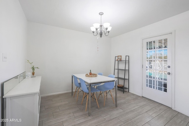 dining space featuring an inviting chandelier