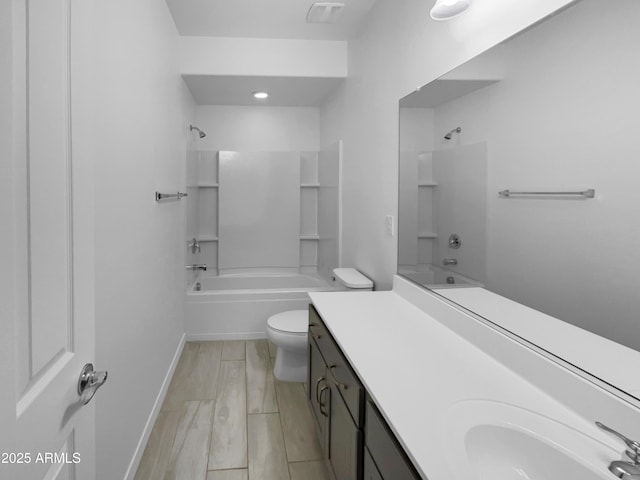 full bath with visible vents, toilet, wood finished floors, bathing tub / shower combination, and vanity