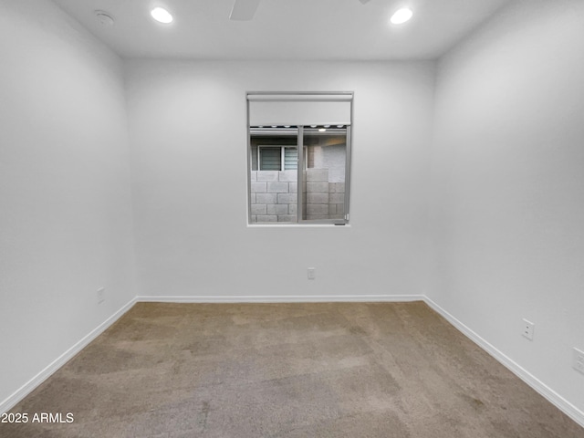 empty room with recessed lighting, baseboards, carpet, and ceiling fan