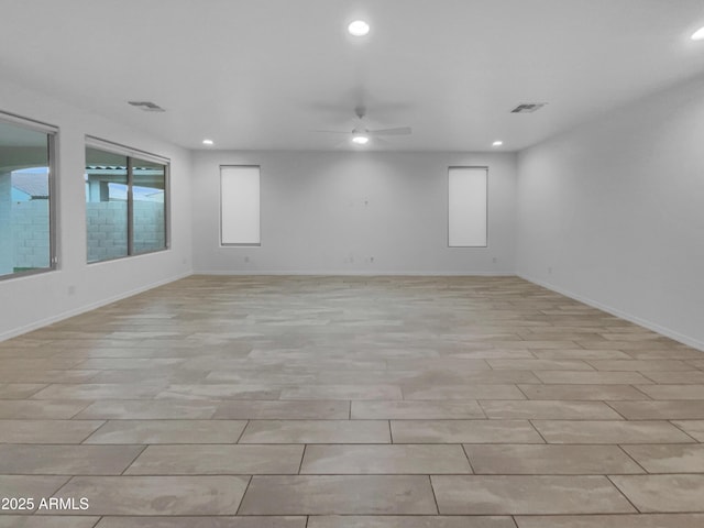 spare room with visible vents, recessed lighting, baseboards, and ceiling fan