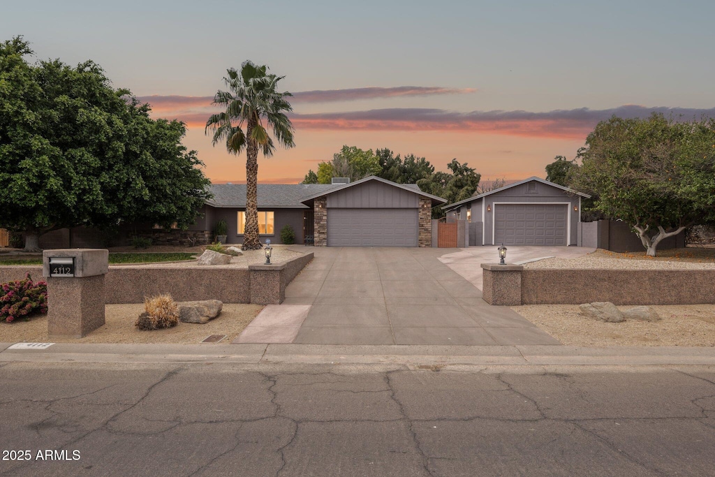 4112 W Monte Cristo Ave, Phoenix, AZ 85053 - ranch-style home with a detached garage and stone siding