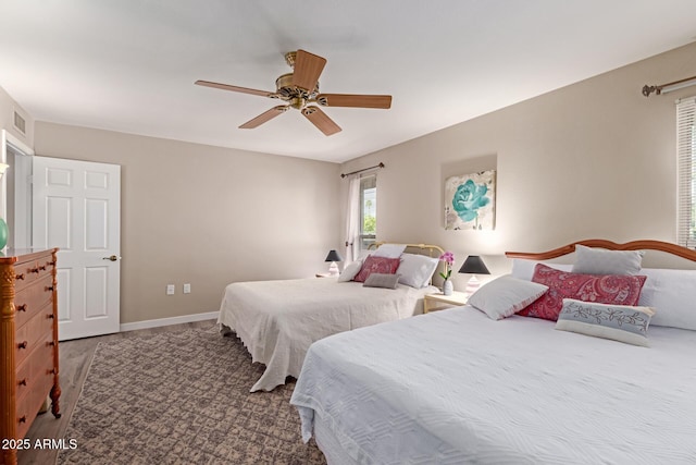 bedroom with baseboards and ceiling fan