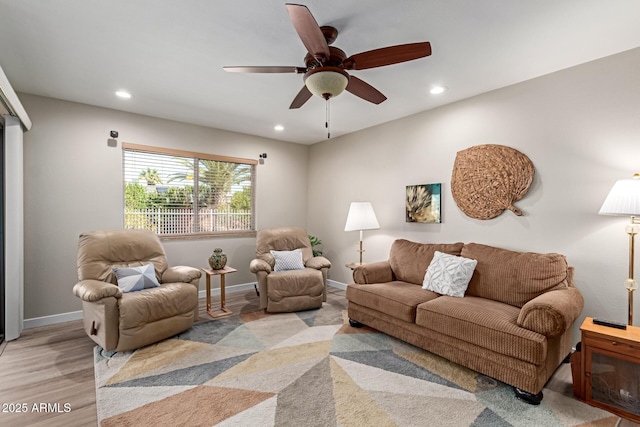 living room featuring recessed lighting, baseboards, and ceiling fan