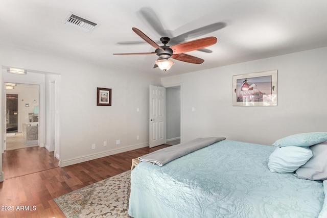 bedroom with visible vents, ceiling fan, baseboards, and wood finished floors