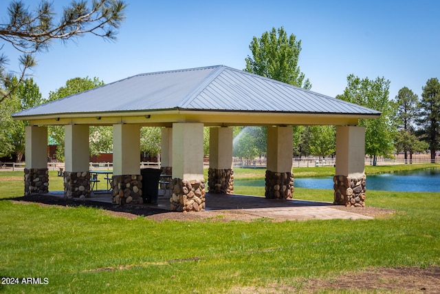 view of home's community featuring a water view, a gazebo, and a yard