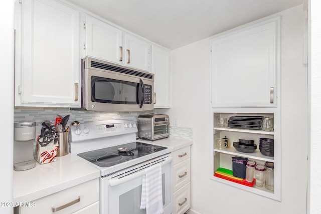 kitchen with white cabinetry, stainless steel microwave, light countertops, and white range with electric cooktop