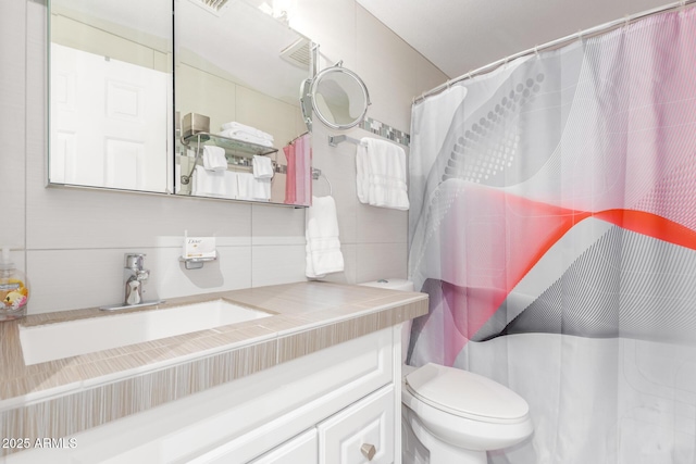 bathroom with tile walls, tasteful backsplash, a shower with shower curtain, toilet, and vanity