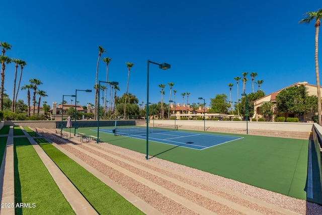 view of tennis court with fence