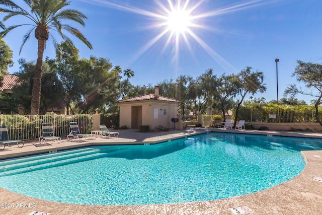 pool featuring a patio and fence