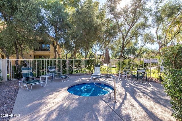 view of pool with fence and a patio