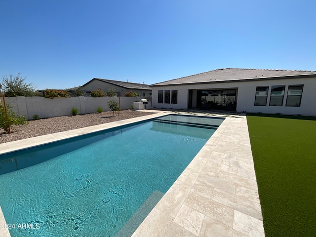 view of swimming pool with a patio area