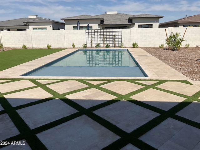 view of swimming pool with a patio