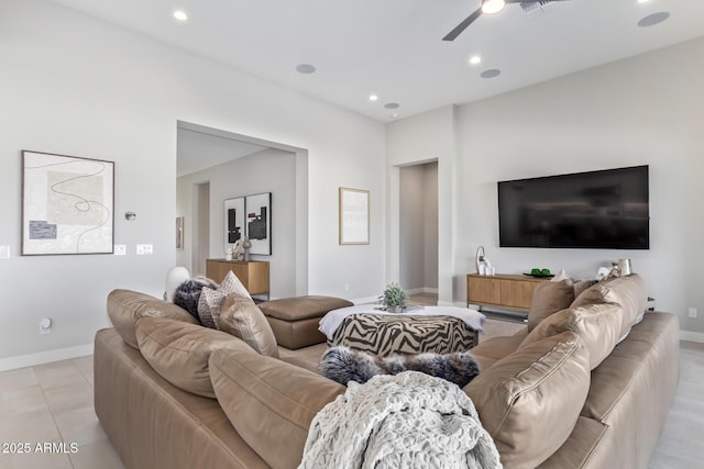 tiled living room featuring ceiling fan