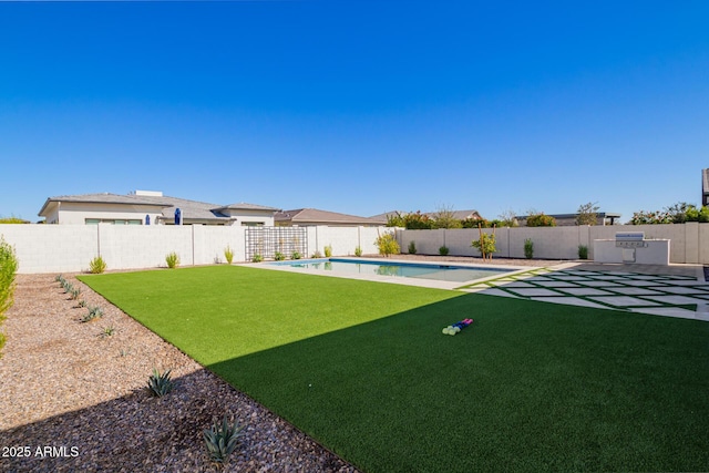 view of yard with a fenced in pool and a patio area