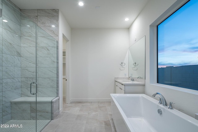 bathroom with vanity and separate shower and tub