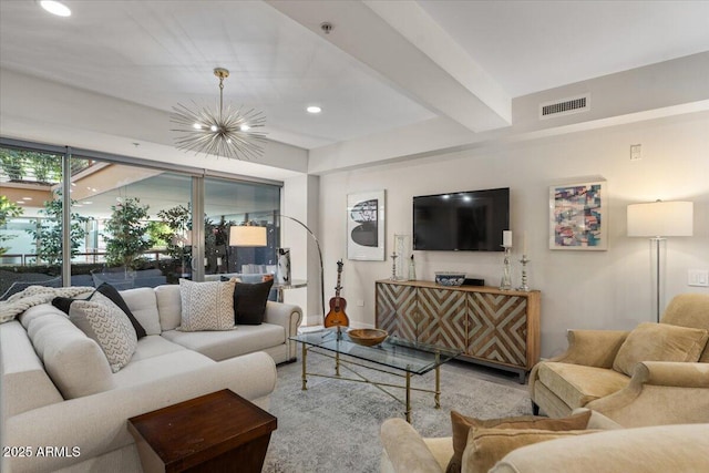 living room featuring beam ceiling and a chandelier