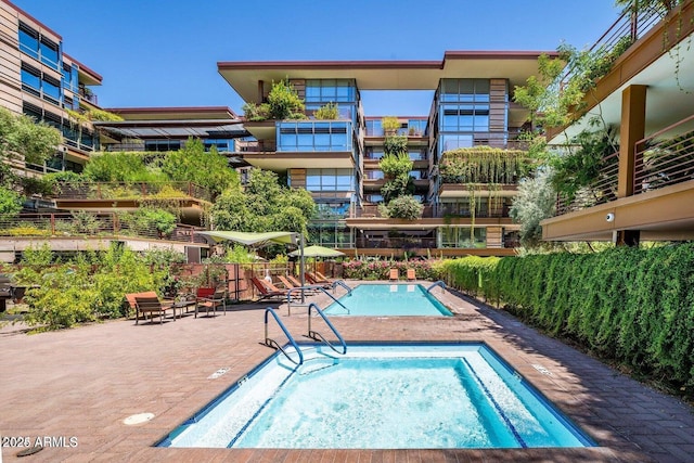 view of swimming pool with a patio