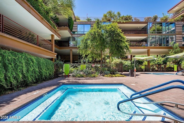 view of swimming pool with a patio