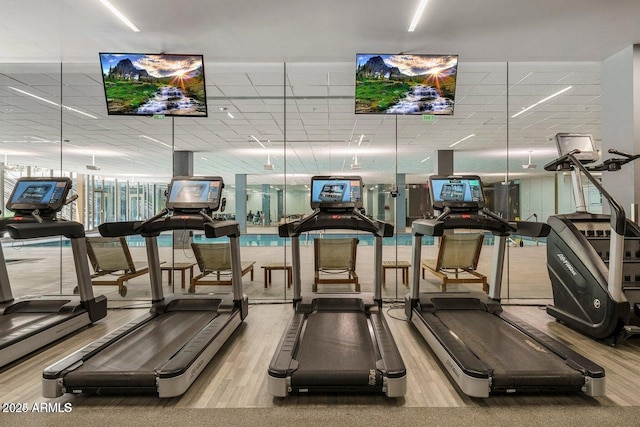 gym with light hardwood / wood-style floors