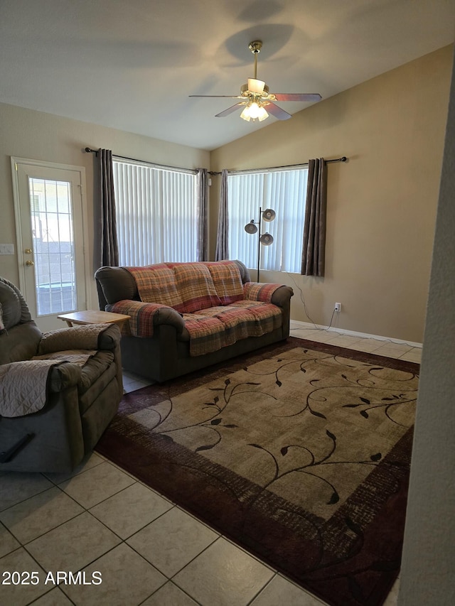 17821 N Woodrose Ave, Surprise, AZ 85374 - tiled living area featuring lofted ceiling, ceiling fan, baseboards, and a wealth of natural light