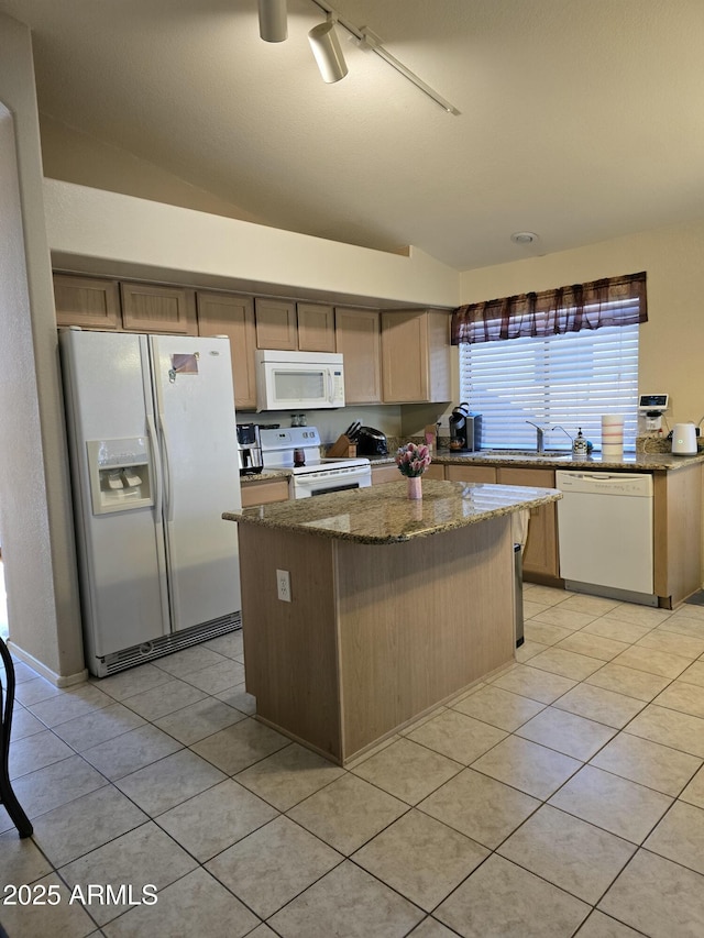 17821 N Woodrose Ave, Surprise, AZ 85374 - kitchen with a center island, white appliances, dark stone countertops, and light tile patterned floors