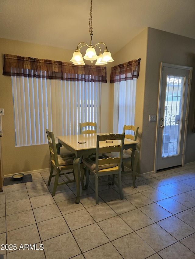 17821 N Woodrose Ave, Surprise, AZ 85374 - dining room with vaulted ceiling, light tile patterned flooring, a wealth of natural light, and baseboards