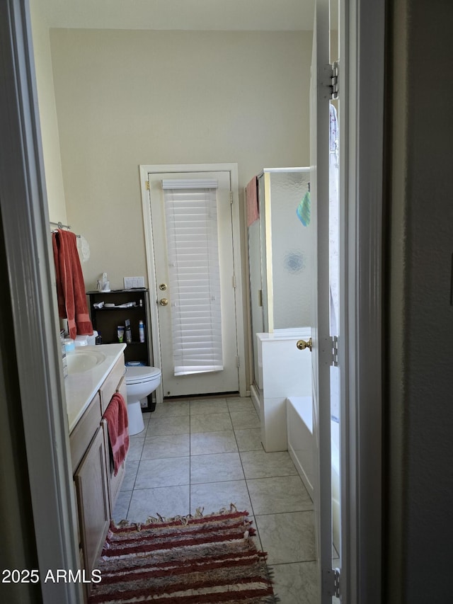 17821 N Woodrose Ave, Surprise, AZ 85374 - bathroom featuring tile patterned flooring, toilet, a washtub, vanity, and a shower stall