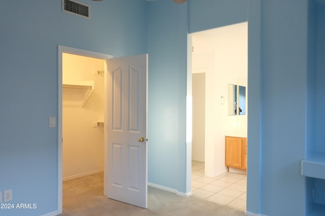 hallway featuring light carpet