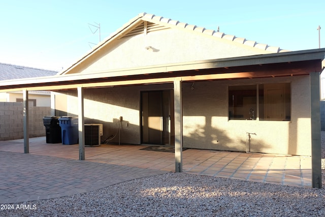 back of house featuring a patio area and central AC unit