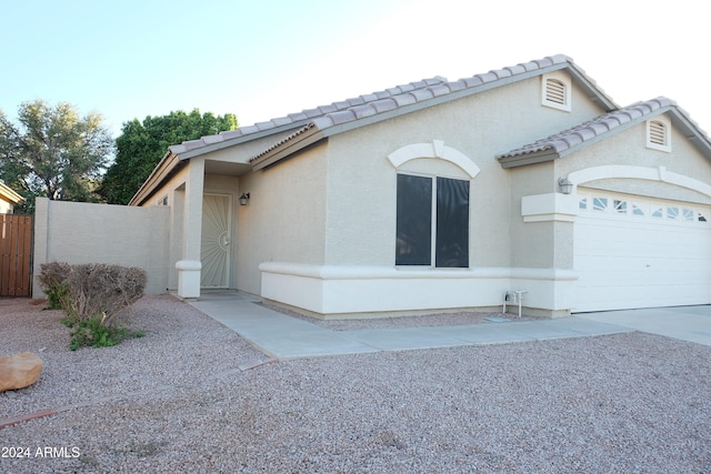 view of front of property with a garage