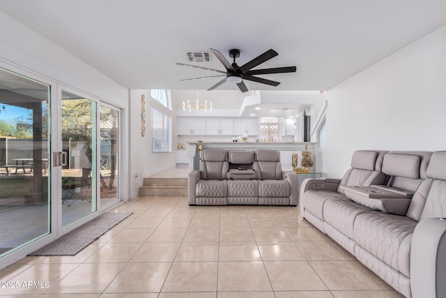 living room featuring light tile patterned floors and ceiling fan