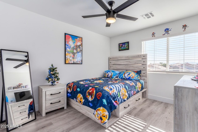 bedroom with ceiling fan and light hardwood / wood-style flooring