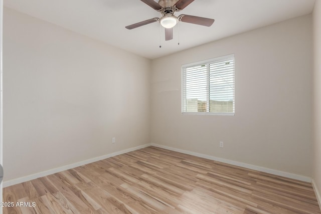 unfurnished room with light wood finished floors, ceiling fan, and baseboards